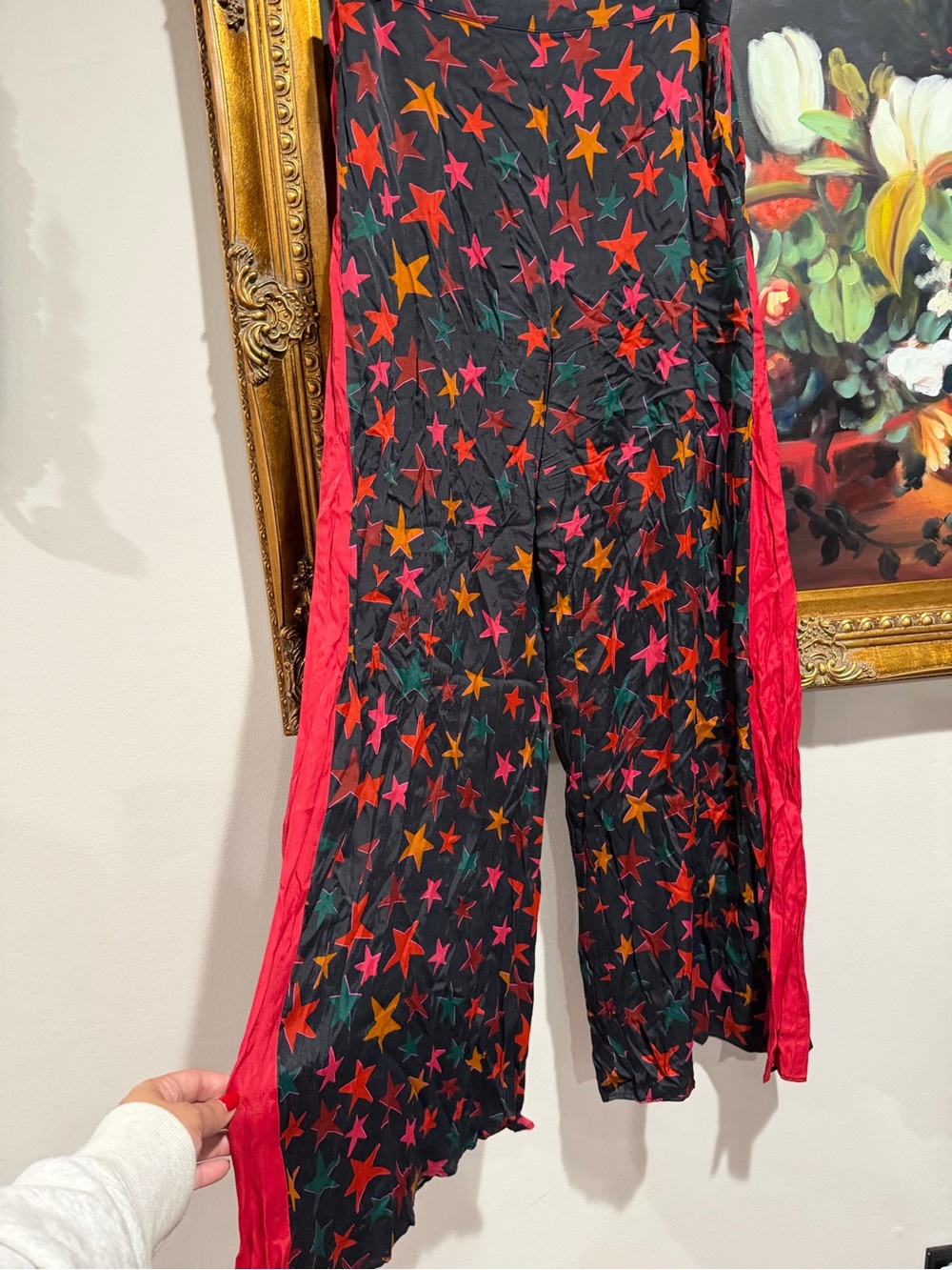 FARM x Anthropologie Rio Black Wide-Leg Star Print Pants with Red & Orange Stars - Picture 3 of 8